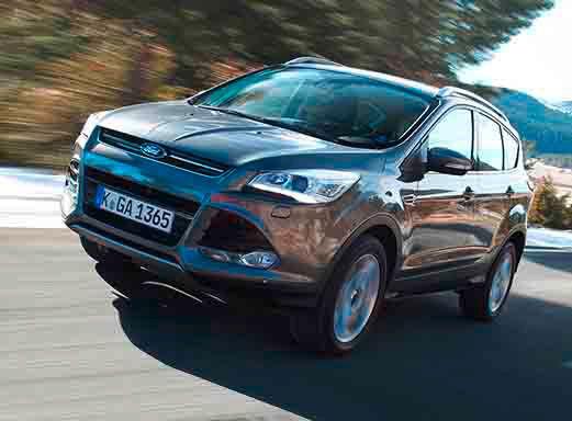Ford Kuga driving on a road.