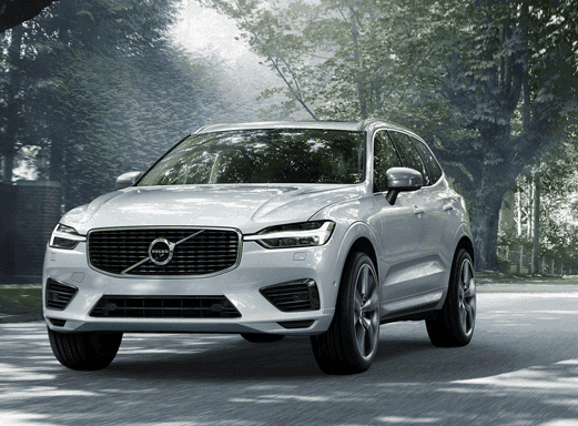 Front view of a white Volvo XC60 on a road.